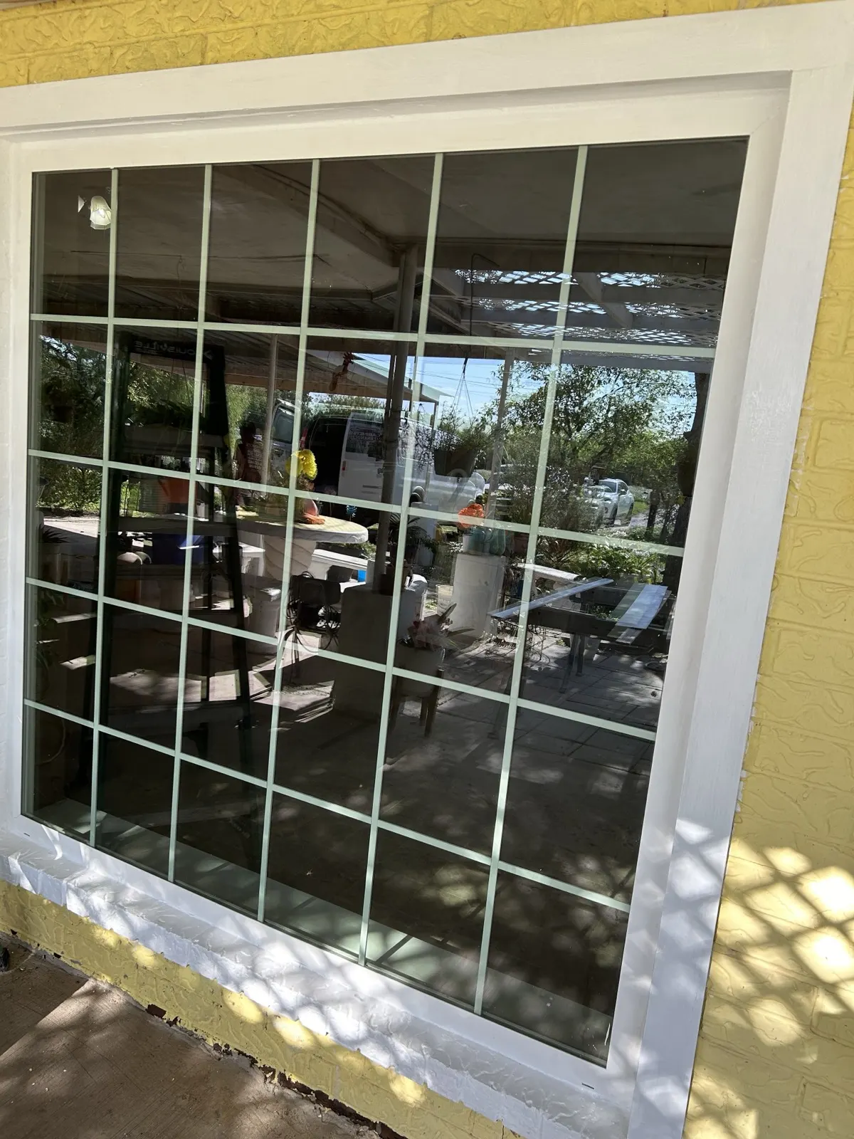 New window installed — large grid window with clean white frame